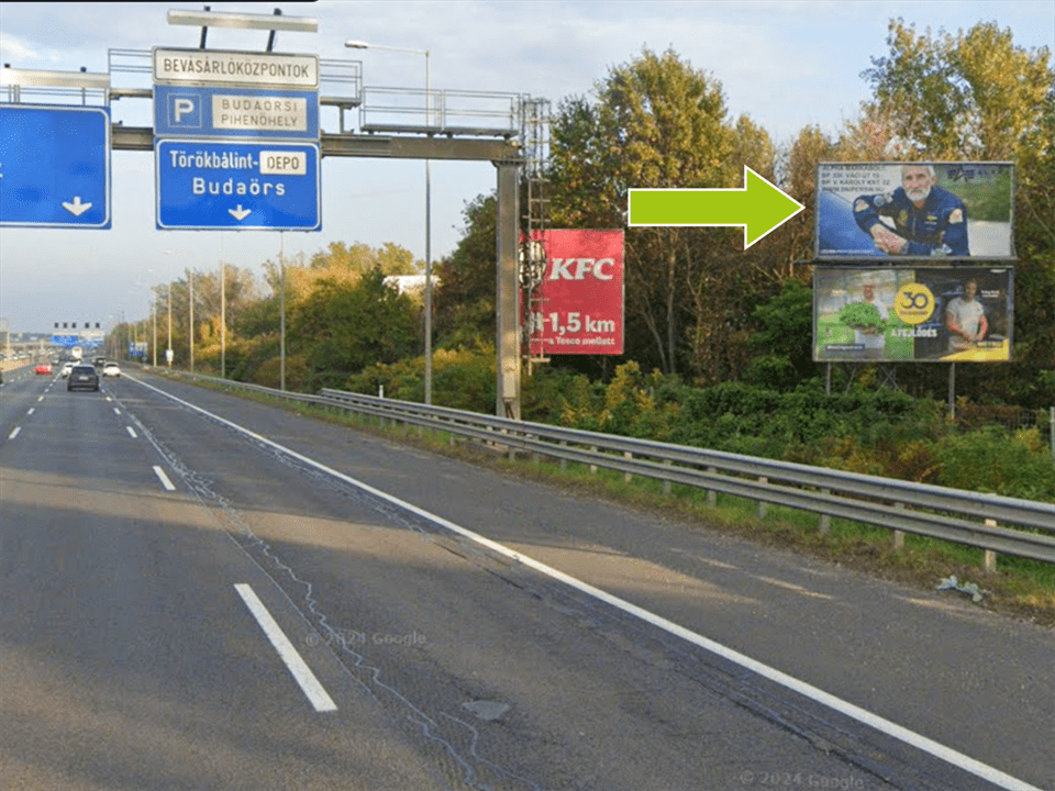 Budaörs – M1-M7 bevezető, Budapest felé, 12km+200, jobb oldalon felső